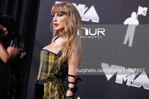 Taylor Swift wearing Dior arrives at the 2024 MTV Video Music Awards held at UBS Arena on September 11, 2024 in Elmont, New York, United Sta...