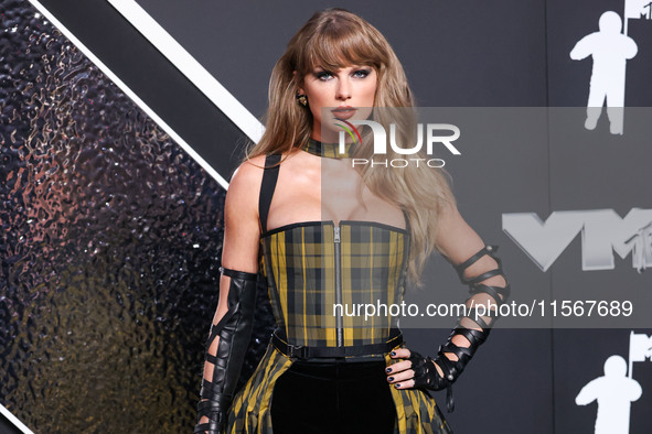 Taylor Swift wearing Dior arrives at the 2024 MTV Video Music Awards held at UBS Arena on September 11, 2024 in Elmont, New York, United Sta...