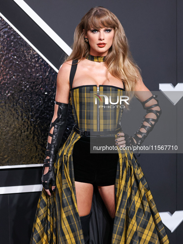 Taylor Swift wearing Dior arrives at the 2024 MTV Video Music Awards held at UBS Arena on September 11, 2024 in Elmont, New York, United Sta...