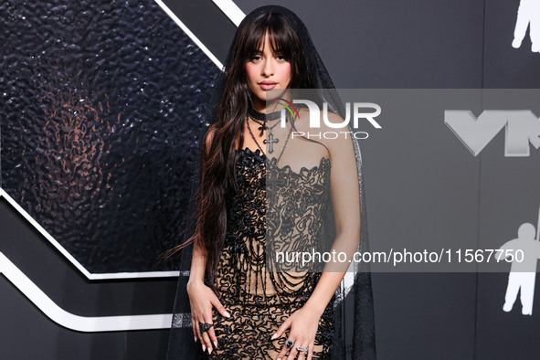 Camila Cabello wearing a Tony Ward look with Loree Rodkin jewelry arrives at the 2024 MTV Video Music Awards held at UBS Arena on September...