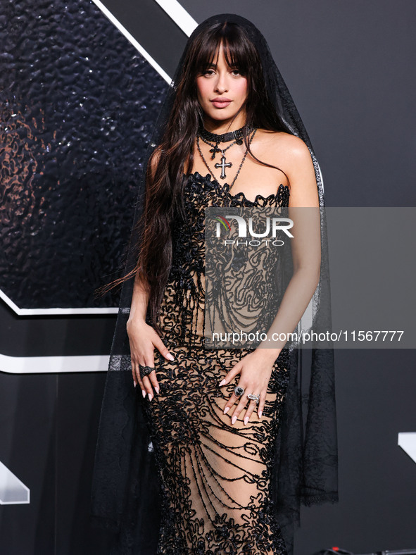 Camila Cabello wearing a Tony Ward look with Loree Rodkin jewelry arrives at the 2024 MTV Video Music Awards held at UBS Arena on September...