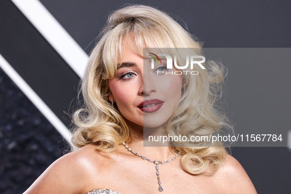 Sabrina Carpenter wearing a vintage Bob Mackie dress from Tab Vintage arrives at the 2024 MTV Video Music Awards held at UBS Arena on Septem...