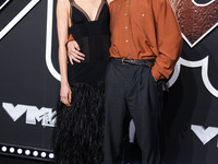 Margaret Qualley and Jack Antonoff arrive at the 2024 MTV Video Music Awards held at UBS Arena on September 11, 2024 in Elmont, New York, Un...