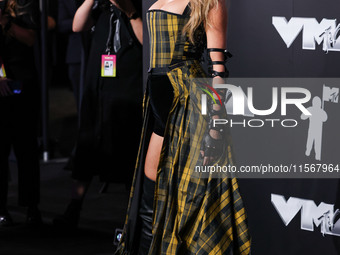 Taylor Swift wearing Dior arrives at the 2024 MTV Video Music Awards held at UBS Arena on September 11, 2024 in Elmont, New York, United Sta...