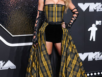 Taylor Swift wearing Dior arrives at the 2024 MTV Video Music Awards held at UBS Arena on September 11, 2024 in Elmont, New York, United Sta...