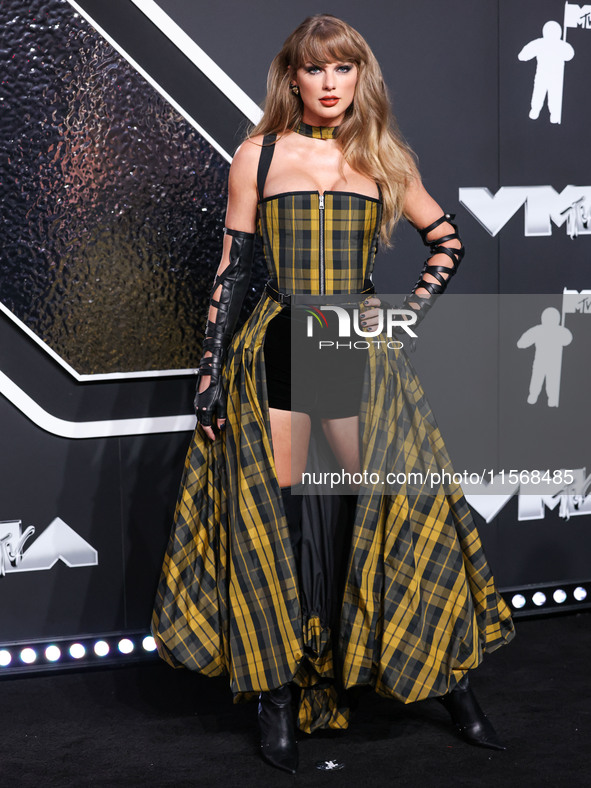 Taylor Swift wearing Dior arrives at the 2024 MTV Video Music Awards held at UBS Arena on September 11, 2024 in Elmont, New York, United Sta...