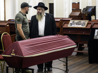 Ukrainian Jews, relatives, and friends attend a farewell ceremony for the late Ukrainian serviceman Matisyahu (Anton) Samborskiy at the Cent...