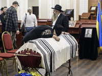 Ukrainian Jews, relatives, and friends attend a farewell ceremony for the late Ukrainian serviceman Matisyahu (Anton) Samborskiy at the Cent...