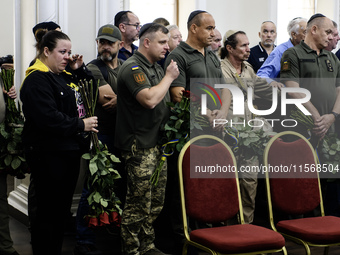 Ukrainian Jews, relatives, and friends attend a farewell ceremony for the late Ukrainian serviceman Matisyahu (Anton) Samborskiy at the Cent...