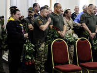 Ukrainian Jews, relatives, and friends attend a farewell ceremony for the late Ukrainian serviceman Matisyahu (Anton) Samborskiy at the Cent...