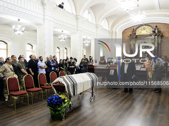 Ukrainian Jews, relatives, and friends attend a farewell ceremony for the late Ukrainian serviceman Matisyahu (Anton) Samborskiy at the Cent...