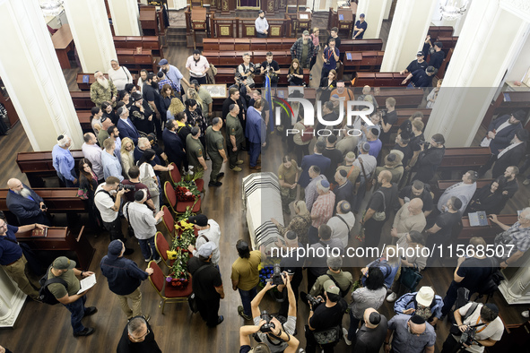 Ukrainian Jews, relatives, and friends attend a farewell ceremony for the late Ukrainian serviceman Matisyahu (Anton) Samborskiy at the Cent...