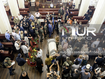 Ukrainian Jews, relatives, and friends attend a farewell ceremony for the late Ukrainian serviceman Matisyahu (Anton) Samborskiy at the Cent...