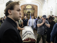 Ukrainian Jews, relatives, and friends attend a farewell ceremony for the late Ukrainian serviceman Matisyahu (Anton) Samborskiy at the Cent...