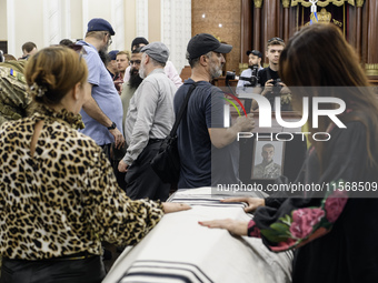 Ukrainian Jews, relatives, and friends attend a farewell ceremony for the late Ukrainian serviceman Matisyahu (Anton) Samborskiy at the Cent...