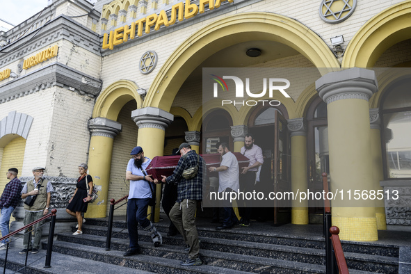 Ukrainian Jews, relatives, and friends attend a farewell ceremony for the late Ukrainian serviceman Matisyahu (Anton) Samborskiy at the Cent...