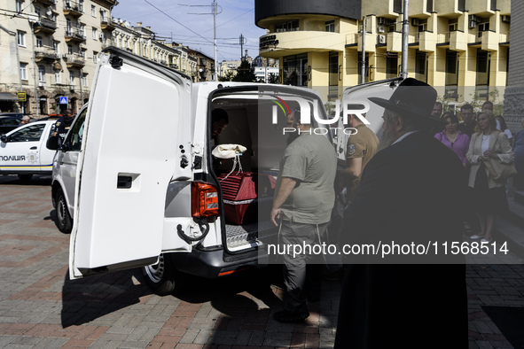 Ukrainian Jews, relatives, and friends attend a farewell ceremony for the late Ukrainian serviceman Matisyahu (Anton) Samborskiy at the Cent...