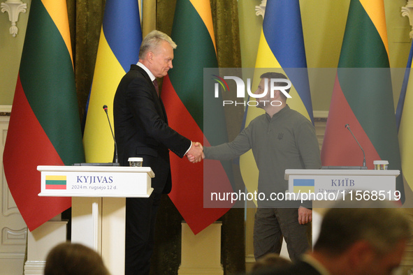 President of Ukraine Volodymyr Zelenskyy and President of Lithuania Gitanas Nauseda shake hands during a joint press conference in Kyiv, Ukr...