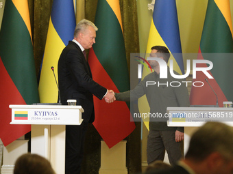 President of Ukraine Volodymyr Zelenskyy and President of Lithuania Gitanas Nauseda shake hands during a joint press conference in Kyiv, Ukr...