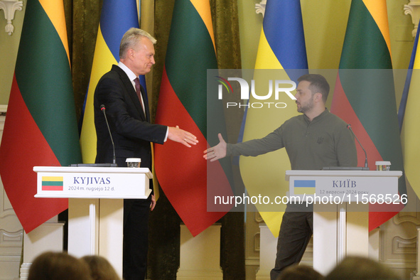 President of Ukraine Volodymyr Zelenskyy and President of Lithuania Gitanas Nauseda shake hands during a joint press conference in Kyiv, Ukr...