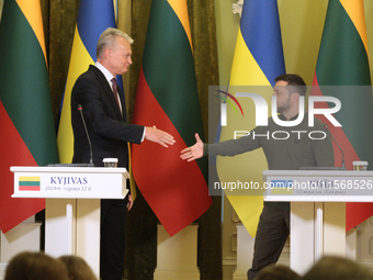 President of Ukraine Volodymyr Zelenskyy and President of Lithuania Gitanas Nauseda shake hands during a joint press conference in Kyiv, Ukr...