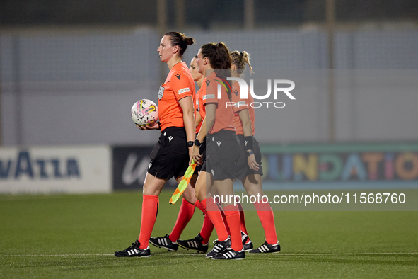 In Ta' Qali, Malta, on September 4, 2024, UEFA-appointed match referee Louise Thompson leads her two assistant referees and the fourth offic...