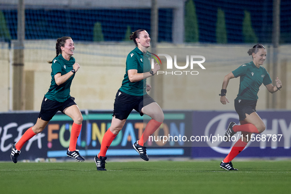 In Ta' Qali, Malta, on September 4, 2024, UEFA-appointed match referee Louise Thompson (C) trains with assistant referees Rachel Greer (L) a...