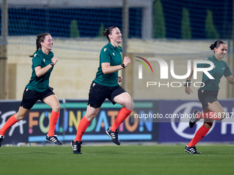 In Ta' Qali, Malta, on September 4, 2024, UEFA-appointed match referee Louise Thompson (C) trains with assistant referees Rachel Greer (L) a...