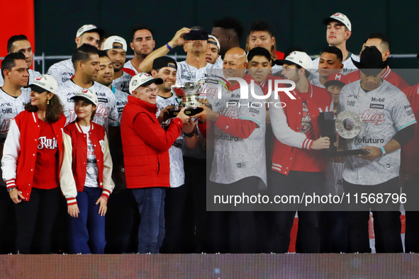 Alfredo Harp Helu and Santiago Harp celebrate The Diablos Rojos del Mexico 17th championship of the Mexican Baseball League (LMB) during the...