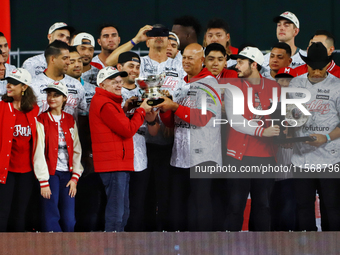 Alfredo Harp Helu and Santiago Harp celebrate The Diablos Rojos del Mexico 17th championship of the Mexican Baseball League (LMB) during the...