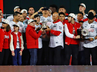 Alfredo Harp Helu and Santiago Harp celebrate The Diablos Rojos del Mexico 17th championship of the Mexican Baseball League (LMB) during the...