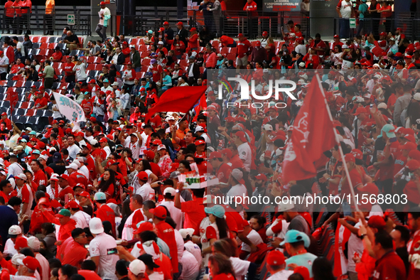 Diablos Rojos del Mexico fans celebrate the Diablos Rojos' 17th championship of the Mexican Baseball League (LMB) during the victory parade...