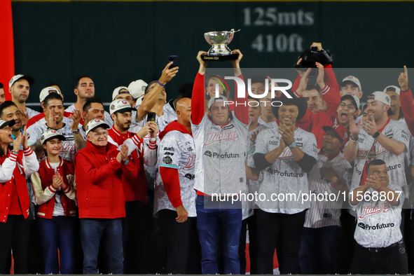 Trevor Bauer lifts the Zaachila cup celebrating The Diablos Rojos del Mexico 17th championship of the Mexican Baseball League (LMB) during t...