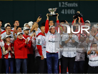 Trevor Bauer lifts the Zaachila cup celebrating The Diablos Rojos del Mexico 17th championship of the Mexican Baseball League (LMB) during t...