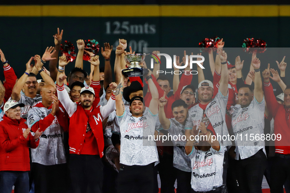 Juan Carlos Gamboa lifts the Zaachila cup celebrating The Diablos Rojos del Mexico 17th championship of the Mexican Baseball League (LMB) du...