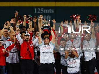 Juan Carlos Gamboa lifts the Zaachila cup celebrating The Diablos Rojos del Mexico 17th championship of the Mexican Baseball League (LMB) du...