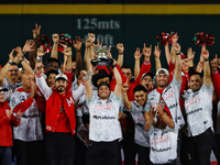 Juan Carlos Gamboa lifts the Zaachila cup celebrating The Diablos Rojos del Mexico 17th championship of the Mexican Baseball League (LMB) du...