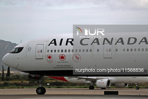 Air Canada Boeing 777-333(ER) with special Go Canada Go livery flies members of the Olympic and Paralympic teams to the Paris Games and carr...