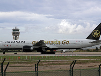 Air Canada Boeing 777-333(ER) with special Go Canada Go livery flies members of the Olympic and Paralympic teams to the Paris Games and carr...