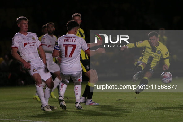 Josh March of Harrogate Town mishits a shot during the Sky Bet League 2 match between Harrogate Town and Doncaster Rovers at Wetherby Road i...