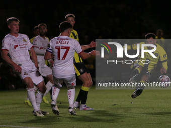 Josh March of Harrogate Town mishits a shot during the Sky Bet League 2 match between Harrogate Town and Doncaster Rovers at Wetherby Road i...