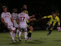 Josh March of Harrogate Town mishits a shot during the Sky Bet League 2 match between Harrogate Town and Doncaster Rovers at Wetherby Road i...