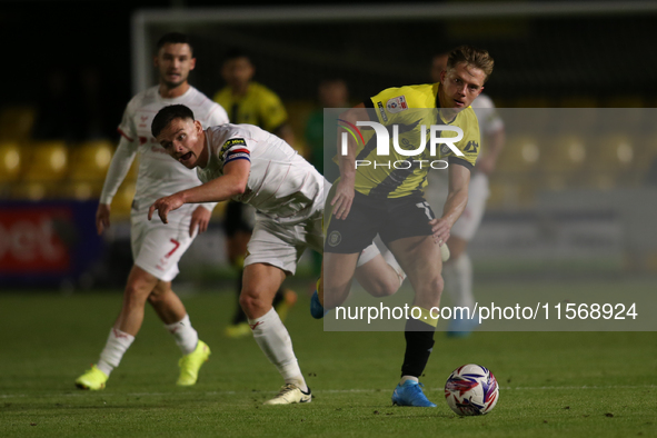 James Daly of Harrogate Town breaks away from Owen Bailey of Doncaster Rovers during the Sky Bet League 2 match between Harrogate Town and D...