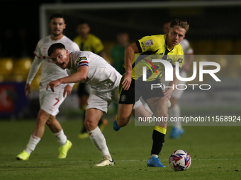 James Daly of Harrogate Town breaks away from Owen Bailey of Doncaster Rovers during the Sky Bet League 2 match between Harrogate Town and D...