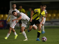 James Daly of Harrogate Town breaks away from Owen Bailey of Doncaster Rovers during the Sky Bet League 2 match between Harrogate Town and D...