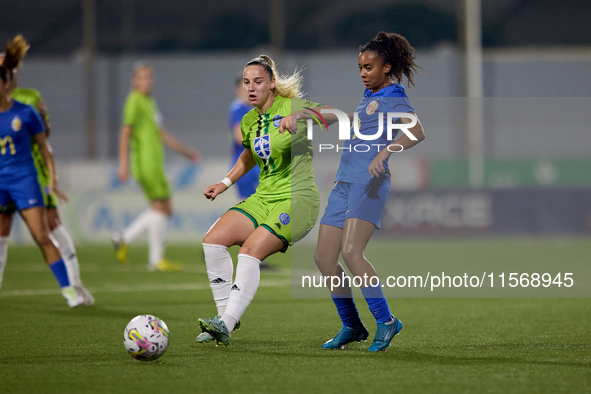 Luana Vitoria Lourenco Cabral (R) of Birkirkara competes for the ball with Enida Bosnjak (L) of Breznica during the UEFA Women's Champions L...