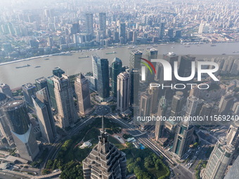 An aerial photo shows high-rise buildings along the Huangpu River in Lujiazui, Shanghai, China, on May 19, 2017. (