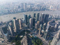 An aerial photo shows high-rise buildings along the Huangpu River in Lujiazui, Shanghai, China, on May 19, 2017. (