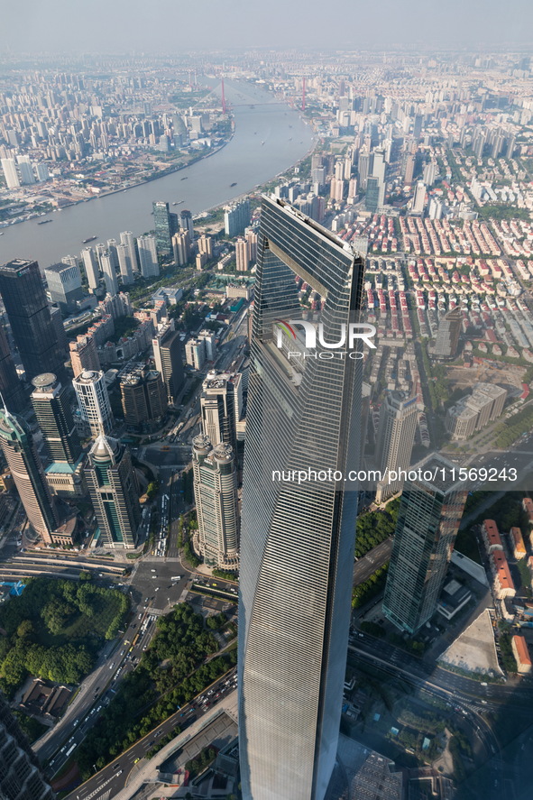 An aerial photo shows high-rise buildings along the Huangpu River in Lujiazui, Shanghai, China, on May 19, 2017. 