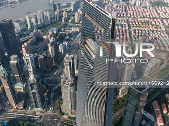 An aerial photo shows high-rise buildings along the Huangpu River in Lujiazui, Shanghai, China, on May 19, 2017. (